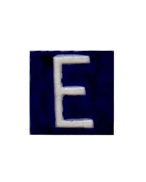 White F alphabet blue tile (2x2)